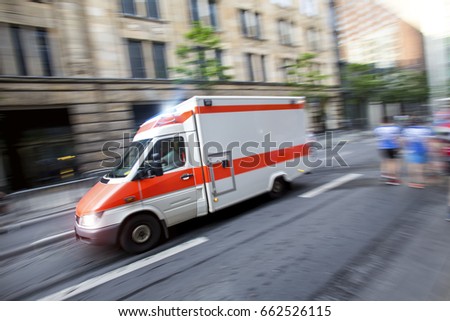 speeding ambulance car in a city