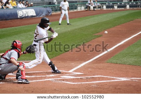 PITTSBURGH - SEPTEMBER 24 : Andrew McCutcheon of the Pittsburgh Pirates swings at a pitch against the Cincinnati Reds on September 24, 2009 in Pittsburgh, PA.