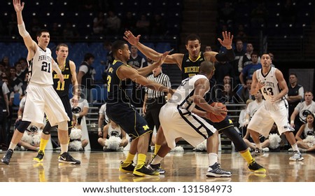 UNIVERSITY PARK, PA - FEBRUARY 27: Penn State\'s JeD.J. Newbill is doubled teams by Michigan at the Byrce Jordan Center February 27, 2013 in University Park, PA