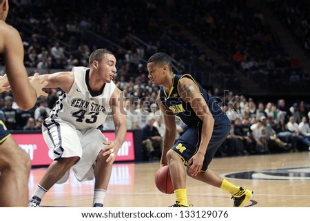 UNIVERSITY PARK, PA - FEBRUARY 27: Michigan\'s Trey Burke drives to the basket against Penn State at the Byrce Jordan Center February 27, 2013 in University Park, PA