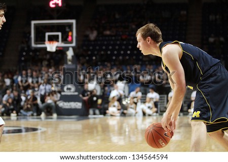 UNIVERSITY PARK, PA - FEBRUARY 27: Michigan\'s Spike Albrecht No. 2 looks to pass as Penn State defends at the Byrce Jordan Center February 27, 2013 in University Park, PA