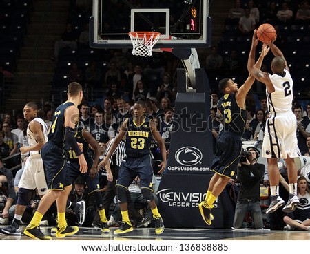 UNIVERSITY PARK, PA - FEBRUARY 27: Penn State's D.J. Newbill shoots over a Michigan  defender at the Byrce Jordan Center February 27, 2013 in University Park, PA
