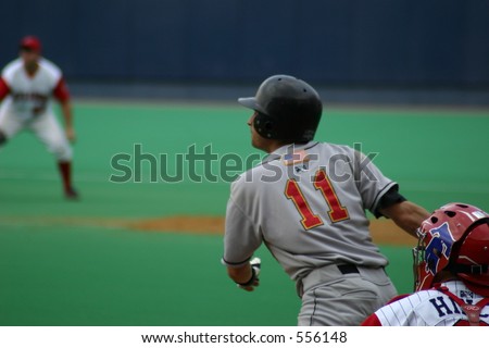 baseball batter watching his hit, Baseball Player following through on his hit