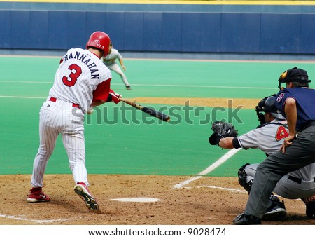 Right-handed baseball batter swinging at a pitch