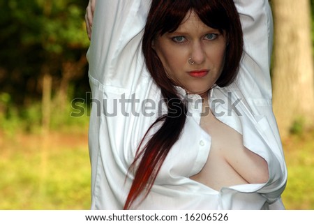 Redhead in a man\'s button down shirt, blue eyes nose ring