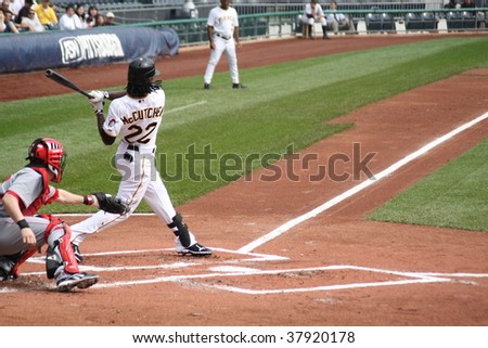 PITTSBURGH - SEPTEMBER 24 : Andrew McCutchen of Pittsburgh Pirates swings at a pitch against Cincinnati Reds on September 24, 2009 in Pittsburgh, PA.