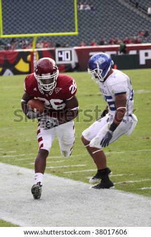 PHILADELPHIA, PA. - SEPTEMBER 26 : Temple receiver Joe Jones catches a pass and is forced out of bounds against Buffalo on September 26, 2009 in Philadelphia, PA.