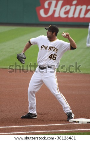 PITTSBURGH - SEPTEMBER 24 : Garrett Jones of Pittsburgh Pirates playing first base against the Reds on September 24, 2009 in Pittsburgh, PA.