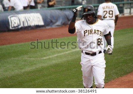 PITTSBURGH - SEPTEMBER 24 : Lastings Miledge of Pittsburgh Pirates crosses home plate after hitting a home run against Cincinnati Reds on September 24, 2009 in Pittsburgh, PA.