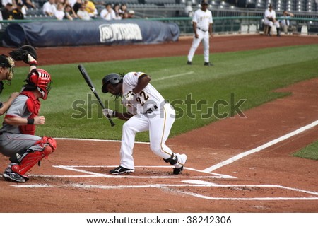 PITTSBURGH - SEPTEMBER 24 : Andrew McCutchen of Pittsburgh Pirates gets out of the way of a pitch pitch against Cincinnati Reds on September 24, 2009 in Pittsburgh, PA.