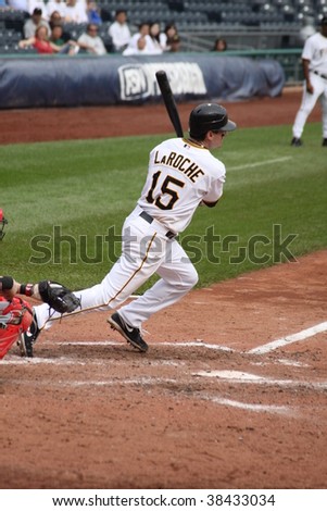 PITTSBURGH - SEPTEMBER 24 : Andy LaRoche of the  Pittsburgh Pirates swings at a pitch against the Cincinnati Reds on September 24, 2009 in Pittsburgh, PA.