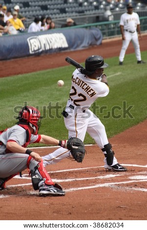 PITTSBURGH - SEPTEMBER 24 : Andrew McCutchen of the Pittsburgh Pirates swings at a pitch and hits a pop-up against Cincinnati Reds on September 24, 2009 in Pittsburgh, PA.