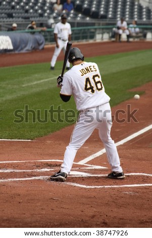 PITTSBURGH - SEPTEMBER 24 : Garrett Jones of the Pittsburgh Pirates swings at a pitch against Cincinnati Reds on September 24, 2009 in Pittsburgh, PA.
