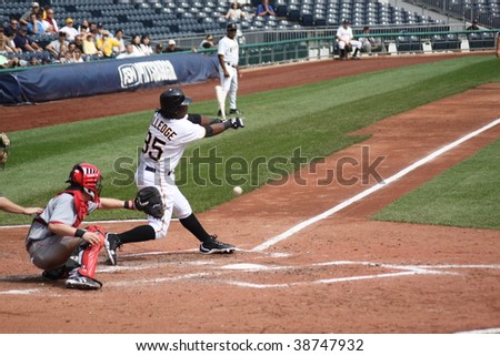 PITTSBURGH - SEPTEMBER 24 : Lastings Miledge of the Pittsburgh Pirates swings at a pitch against Cincinnati Reds on September 24, 2009 in Pittsburgh, PA.