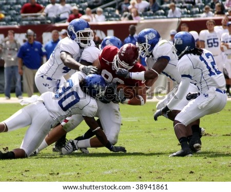 defenders tackle Temple wide out