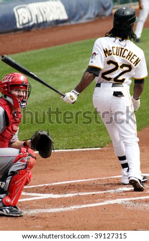 PITTSBURGH - SEPTEMBER 24 : Andrew McCutchen of the Pittsburgh Pirates swings at a pitch against Cincinnati Reds on September 24, 2009 in Pittsburgh, PA.