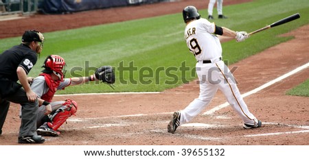 PITTSBURGH - SEPTEMBER 24 : Neil Walker of the Pittsburgh Pirates swings at a pitch against Cincinnati Reds on September 24, 2009 in Pittsburgh, PA.