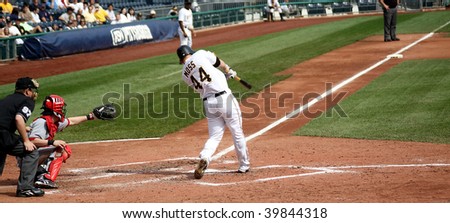 PITTSBURGH - SEPTEMBER 24 : Brandon Moss of the Pittsburgh Pirates hits a single against the Cincinnati Reds on September 24, 2009 in Pittsburgh, PA.
