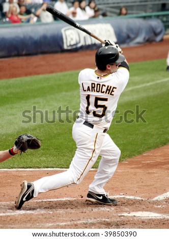 PITTSBURGH - SEPTEMBER 24 : Adam LaRoche of the Pittsburgh Pirates hits a single against the Cincinnati Reds on September 24, 2009 in Pittsburgh, PA.