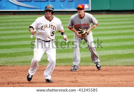 PITTSBURGH - SEPTEMBER 24 :Brandon Moss  of the Pittsburgh Pirates takes a lead off of second base against the Cincinnati Reds on September 24, 2009 in Pittsburgh, PA.