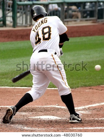 PITTSBURGH - SEPTEMBER 24 : Delwyn Young of the Pittsburgh Pirates swings at a pitch against the Cincinnati Reds on September 24, 2009 in Pittsburgh, Pa.