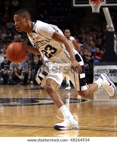UNIVERSITY PARK, PA - FEBRUARY 24: Penn State\'s #23 Tim Fraizer drives to the basket in a game against Ohio State at the Byrce Jordan Center February 24, 2010 in University Park, PA