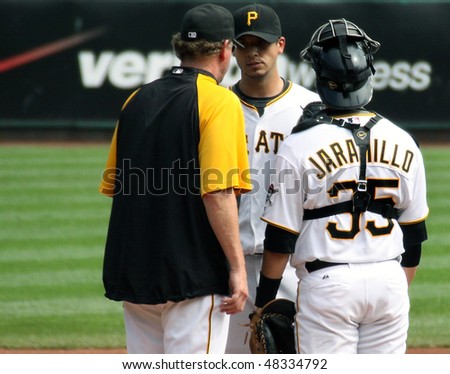 PITTSBURGH - SEPTEMBER 24: Pittsburgh Pirates\' pitching coach, Joe Kerrigan speaks with Charlie Morton during a game against Cincinnati Reds on September 24, 2009 in Pittsburgh, PA.