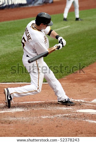 PITTSBURGH - SEPTEMBER 24 : Andy LaRoche of the Pittsburgh Pirates swings at a pitch against Cincinnati Reds on September 24, 2009 in Pittsburgh, PA.