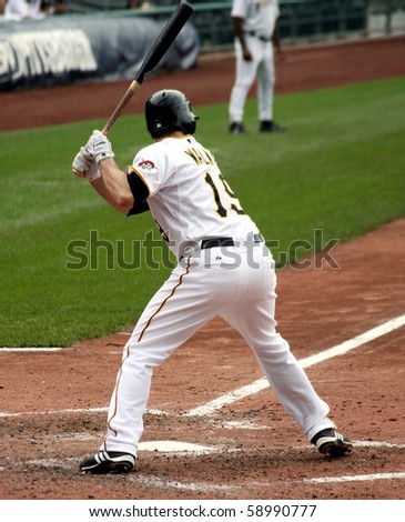PITTSBURGH - SEPTEMBER 24 : Switch-hitter Neil Walker of the Pittsburgh Pirates bats left-handed against Cincinnati Reds on September 24, 2009 in Pittsburgh, PA.