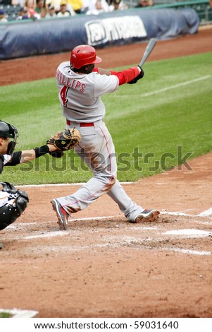 PITTSBURGH - SEPTEMBER 24 : Brandon Phillips of the Cincinnati Reds swings at a pitch against the Pittsburgh Pirates on September 24, 2009 in Pittsburgh, PA.