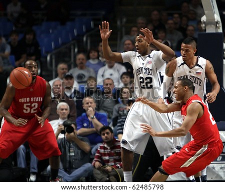 UNIVERSITY PARK, PA - FEBRUARY 24: Ohio State guard Evan Turner #21 spins and passes out of Penn State\'s doble team at the Byrce Jordan Center February 24, 2010 in University Park, PA