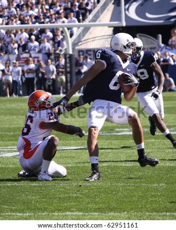 UNIVERSITY PARK, PA - OCT 9: Penn State wide receiver #6 Derek Moye tries to break a tackle against Illinois at Beaver Stadium October 9, 2010 in University Park, PA