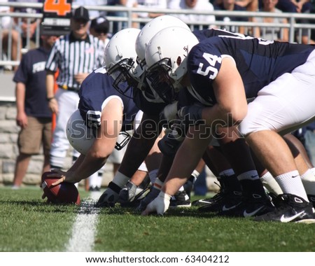 UNIVERSITY PARK, PA - OCT 9: Penn State offensive linemen ready to snap the football against Illinois at Beaver Stadium October 9, 2010 in University Park, PA