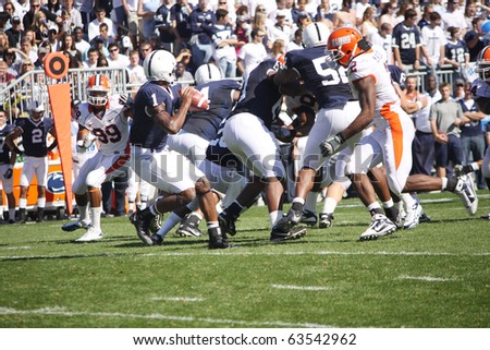 UNIVERSITY PARK, PA - OCT 9: Penn State quarterback #1 Robert Bolden is about to get sacked by Illinois linebacker #2 Martez Wilson at Beaver Stadium October 9, 2010 in University Park, PA