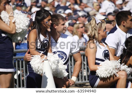 UNIVERSITY PARK, PA - OCT 9: Penn State cheerleaders relax and watch the game against Illinois at Beaver Stadium October 9, 2010 in University Park, PA