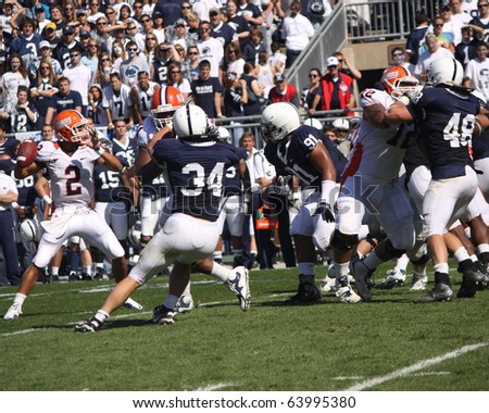 UNIVERSITY PARK, PA - OCT 9: Illinois   quarterback No. 2,  Nathan Scheelhaase is under heavy pressure against Penn State at Beaver Stadium October 9, 2010 in University Park, Pa