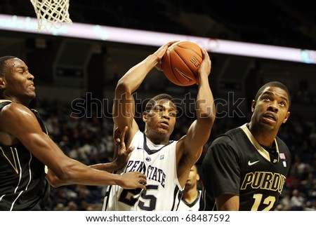 UNIVERSITY PARK, PA - JANUARY 5: Penn State\'s Jeff Brooks pulls down a rebound between two Purdue players at the Byrce Jordan Center January 5, 2011 in University Park, PA