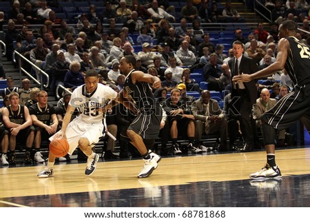 UNIVERSITY PARK, PA - JANUARY 5: Penn State\'s Tim Fraizer drives around Purdue\'s Lewis Jackson during a gamest at the Byrce Jordan Center January 5, 2011 in University Park, PA