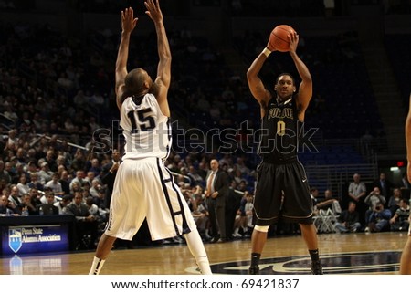 UNIVERSITY PARK, PA - JANUARY 5: Purdue\'s No. 0 Terone Johnson looks to pass as Penn State\'s D.J. Jackson defends in a game at the Byrce Jordan Center on January 5, 2011 in University Park, PA