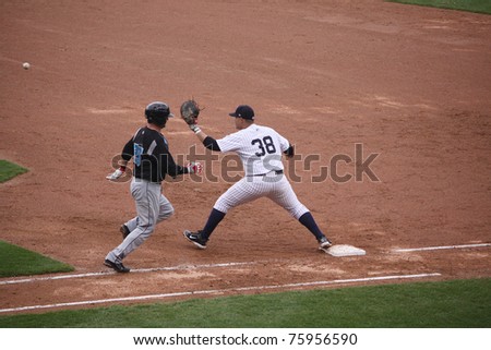 SCRANTON, PA -April 24: Syracuse Skychiefs\' #26 Jesus Flores is out a first base during a game against the Scranton Wilkes Barre Yankees at PNC Field on April 24, 2011 in Scranton, Pa