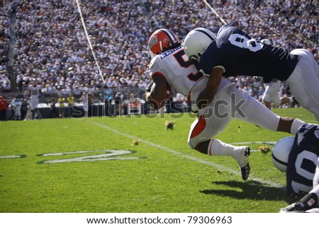 UNIVERSITY PARK, PA - OCT 9: Illinois running back No. 5  Mikel Leshoure is tackled after a long gain during a game against Penn State at Beaver Stadium on October 9, 2010 in University Park, PA