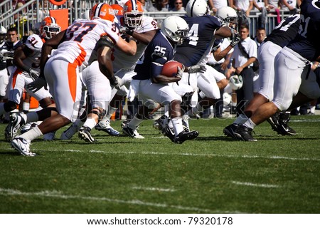 UNIVERSITY PARK, PA - OCT 9: Penn State\'s Silas Redd runs between the tackles against Illinois at Beaver Stadium October 9, 2010 in University Park, PA