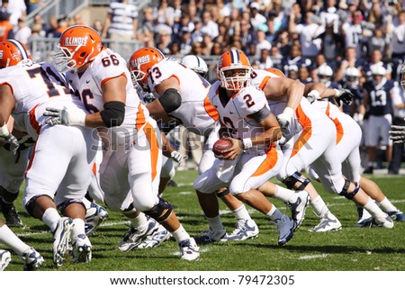 UNIVERSITY PARK, PA - OCT 9: Illinois quarterback No. 2, Nathan Scheelhaase drops back and looks to hand off against Penn State at Beaver Stadium on October 9, 2010 in University Park, PA