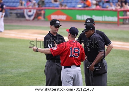 BINGHAMTON, NY - JULY 7: Portland Sea Dogs manager Kevin Boles has a discussion with the umpires in a game against the Binghamton Mets at NYSEG Stadium on July 7, 2011 in Binghamton, NY