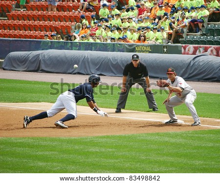SCRANTON, PA - AUGUST 24: Scranton Wilkes Barre Yankees runner Chris Dickerson hustles back to first base in a game against the Rochester Red Wings at PNC Field on August 24, 2011 in Scranton, PA.