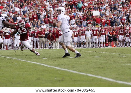 PHILADELPHIA, PA. - SEPTEMBER 17: Penn State Quarterback back Matthew McGloin is pressured by Temple\'s Adrian Robinson (#43) on September 17, 2011 at Lincoln Financial Field in Philadelphia, PA.