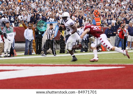 PHILADELPHIA, PA. - SEPTEMBER 17: Penn State running back Silas Redd escapes Temple tacklers and heads for the end zone on September 17, 2011 at Lincoln Financial Field in Philadelphia, PA.