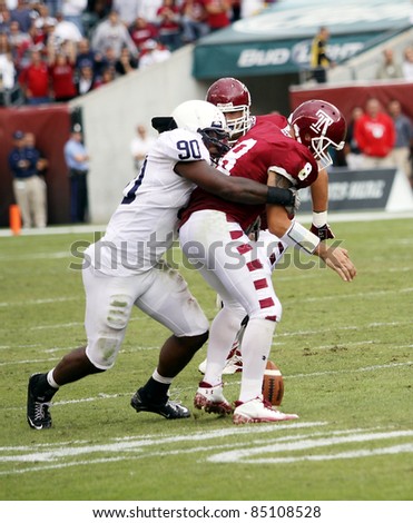 PHILADELPHIA, PA. - SEPTEMBER 17: Temple Quarterback Mike Gerardi is sacked and fumbles, Penn State\'s Sean Stanley tackles on September 17, 2011 at Lincoln Financial Field in Philadelphia, PA.