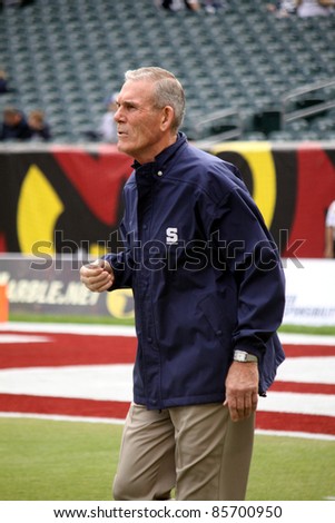 PHILADELPHIA, PA. - SEPTEMBER 17: Penn State coach Dick Anderson runs on the field before a game against Temple on September 17, 2011 at Lincoln Financial Field in Philadelphia, PA.