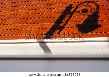 shadow of a street light over a tiled ceiling in mexico